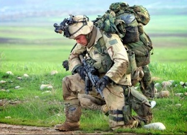 SOLDIER kneeling in prayer