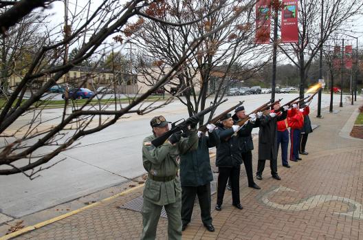 Veterans fire a volley prior to the playing of taps at the Waukesha Allied Veterans Council Veterans Day program at Veterans Park in downtown Waukesha Tuesday, Nov. 11, 2014.