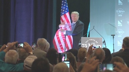 2018_06 19 Trump hugs flag